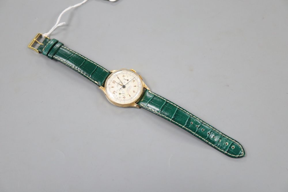 A gentlemans 1950s? 18k Norina chronograph manual wind wrist watch, on later strap.